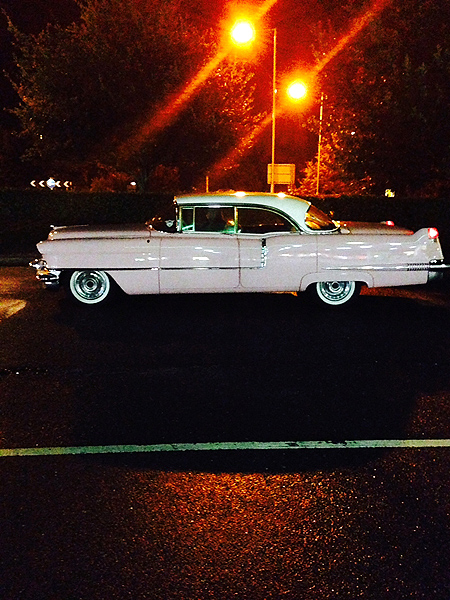 Pink Cadillac at night